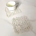 Detailed view of handmade vintage lace square cotton coaster on marble tabletop - Round Sun Radial Hollow Coaster (17)