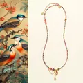 Gros plan du collier en perles de tourmaline arc-en-ciel avec pendentif cœur en or - Pendentif Cœur Tourmaline Arc-en-ciel
