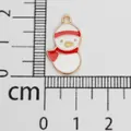 Christmas snowman enamel alloy pendant charm shown next to a centimeter ruler for size - Snowman (7) / Approx. 2.3cmx1.3cm / Light Gold with Red and White