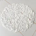 Detailed macro view of white elegant lace embroidered round placemat with floral pattern - 20*20cm / White