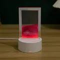 Detalle de primer plano de lámpara de arena movediza 3D con marco LED rojo brillante - Rosa
