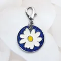 Round blue glitter pet ID tag featuring a white daisy flower charm with silver lobster clasp - Lobster Clasp / Sapphire Blue