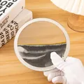 Primer plano de una obra de arte circular de arena movediza 3D con arena negra, blanca y dorada - Black sand table [without base]