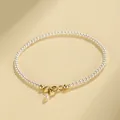 Elegant minimalist tiny white pearl beaded bracelet with a gold-tone lobster clasp closure - 14cm / 2.0mm