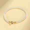 Minimalist white pearl beaded bracelet featuring a classic gold-toned spring ring clasp - 3mm