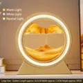 Lámpara de mesa circular dorada de arena movediza con 3 modos de luz ajustables - Batería Seca/Enchufe / 12 Pulgadas / Marco Dorado Arena Amarilla