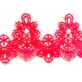 Detailed macro view of vibrant pink water-soluble lace trim with intricate embroidery - Red