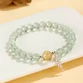 Elegant light green grape stone beaded bracelet with golden bead and silver feather charm - Prehnite & Yellow Citrine Style