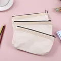 Drei beige minimalistische Segeltuch-Federmäppchen mit schwarzem Reißverschluss - 3er-Set / Blanko Federtasche