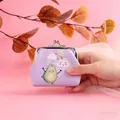 Hand holding a cute purple avocado themed kiss-lock coin purse with rainbow detail - Purple Avocado
