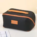 Schwarze Kulturtasche mit Webstruktur, großes Fassungsvermögen und orangefarbenem Griff - Geflochtener Stil / Schwarz