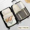 Cream-colored 7-piece travel packing cubes set for organizing clothes and shoes inside suitcase - 7-piece Set / Off White