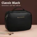 Large capacity black travel makeup organizer bag with handle and gold lettering detail - Handbag Style / Classic Black