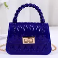Trendige mini tiefblaue Gelee-Handtasche mit gedrehtem Griff und goldener Kette für Damen - Blau