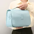 Hellblaue Kulturtasche zum Aufhängen für Damen mit tragbarem Griff - Seeblau