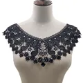 Detail showing intricate embroidery of black water-soluble lace collar on mannequin - Black
