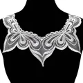 Detailed view of white water-soluble lace collar with delicate mesh embroidery pattern. - White