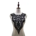 Detailed shot of black water-soluble lace collar appliqué on mannequin torso - Black