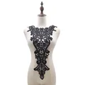 Detailed view of a black water-soluble lace collar with 3D hollow embroidery design - Black