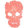 Close-up view of a coral peach skull lace patch with intricate floral water-soluble embroidery - Hot Pink