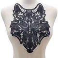 Detailed view of a black wolf head water-soluble lace embroidery patch on mannequin - Wolf Head / Black