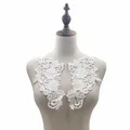 Macro detail of white water-soluble floral lace appliques displayed on a mannequin bust. - 1 Pair Pack / White