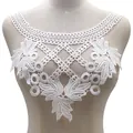 Detailed view of a white water-soluble lace collar featuring intricate floral embroidery - White