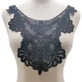 Detailed close-up view of black hollow-out floral lace embroidery collar on mannequin. - Black