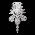 Detailed close-up of white milk silk water-soluble lace embroidery flower patch - White
