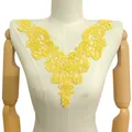 Detailed view of elegant yellow hollow embroidered water-soluble lace neckline applique. - 33cmx27cm / Yellow