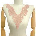 Detail view of a peach water-soluble lace floral embroidery collar applique on a mannequin - 33cmx27cm / Peach Pink