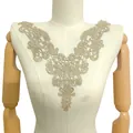 Detailed macro view of gold water-soluble embroidered lace neckline applique on mannequin - 33cmx27cm / Champagne Gold