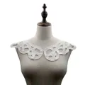Detailed view of white water-soluble lace collar on a mannequin for DIY crafts. - White