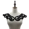 Close-up of black 3D hollow-out lace embroidery collar applique on a dress form - Black