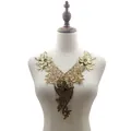 Golden water-soluble lace floral neck applique embroidery displayed on a white mannequin torso - Foil Stamping