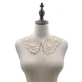 Detailed view of an elegant beige lace collar accessory on a mannequin bust - Beige