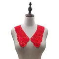 Detailed view of red hollow embroidery lace collar accessory on a beige dress form - Red