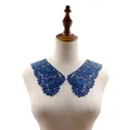 Detailed view of 3D hollow blue embroidered lace collar displayed on a mannequin torso - Dark Blue