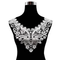 Close-up detail of white water-soluble floral lace collar applique on black mannequin - White