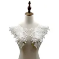 Detailed view of white cotton embroidered lace collar patches displayed on a mannequin - Pair Collar / White