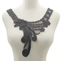 Close-up view of the intricate floral embroidery on black lace faux collar applique - Black