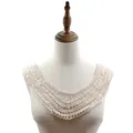 Detailed view of cream cotton crochet lace collar with hollow embroidery on a mannequin - Apricot