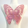 Detailed view of pink gradient butterfly embroidery patch on a white mannequin torso - Butterfly Pattern (LG481) / Rose Pink