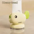 Cute whale-shaped toothpaste squeezer in creamy green finish for bathroom use - Cream Green