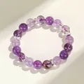 Elegante lavendel amethist kralenarmband met zilveren strikjes tussen de kralen. - Lavendel Braziliaanse Amethist Stijl