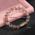 Elegante pulsera de cuentas de cuarzo rutilado Super Seven 10mm con cuenta dorada texturizada - Diámetro de perla 10mm / Super Siete Oro Negro