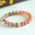 Elegant 925 silver snake charm bracelet with Sunstone and Super Seven crystals - 925 Silver Snake Sunstone Super Seven Bracelet
