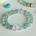 Elegant green fluorite and white crystal beaded bracelet with a cute central bow charm - Green Fluorite White Crystal Bow Style