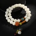 Elegantes weißes Bodhi-Samen-Armband mit doppelter Schleife und ethnischen Perlen - Wickel-Perlen-Stil / Weiß