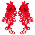 Close-up of red 3D floral lace patches with intricate water-soluble embroidery - Red